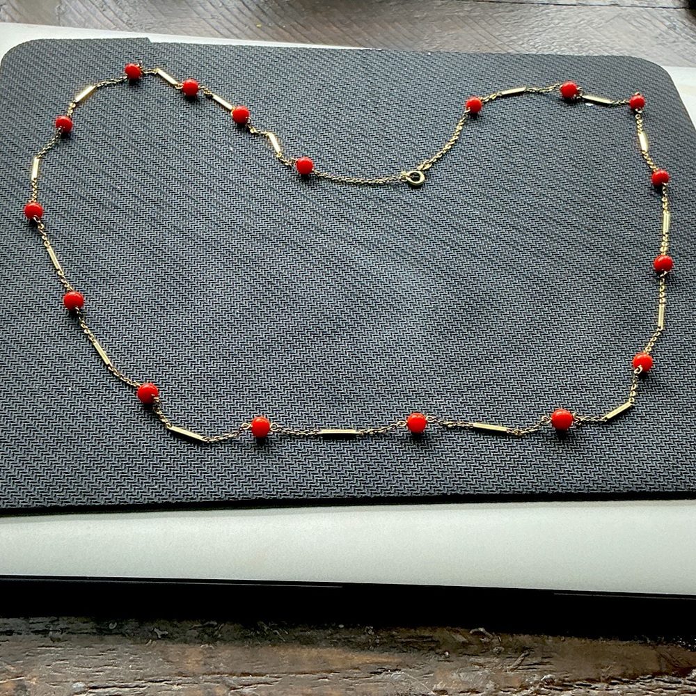 Chic 14K gold and salmon colored coral beads.